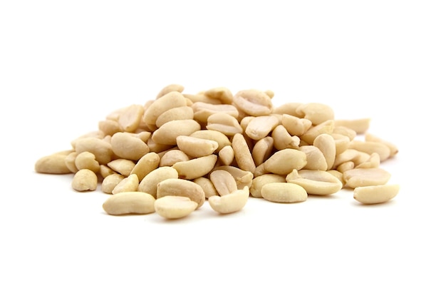 Raw blanched peanuts isolated on white background