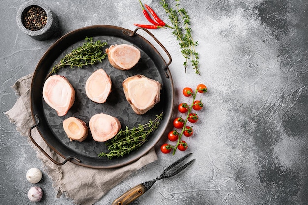 Raw brain beef bone set, on gray stone table background, top view flat lay, with copy space for text