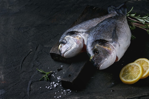 Raw bream fish with herbs