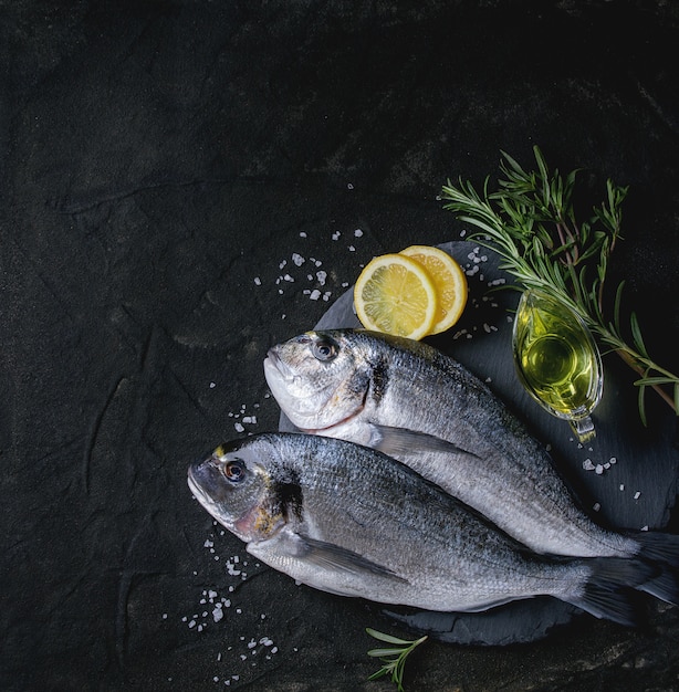 Raw bream fish with herbs