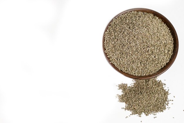 Raw Brown Organic Ajwain Seed in a Bowl isolated on white background