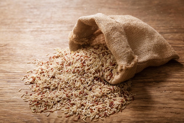 Raw brown rice on a wooden table