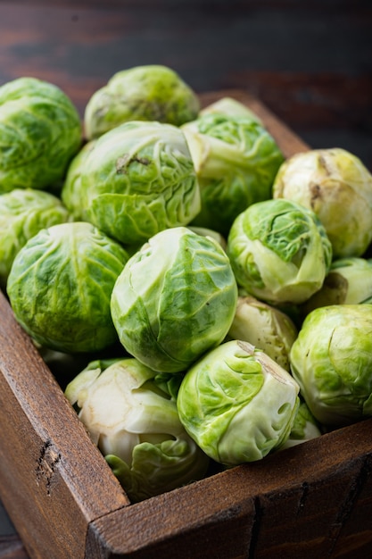 Raw brussels sprouts, on old wooden table