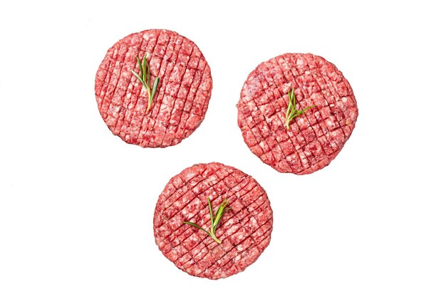 Foto cottlet di hamburger crudo a base di carne di manzo con spezie e rosmarino pronto per la cottura con sfondo bianco isolato