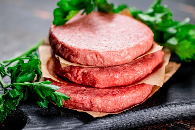 Raw burger with parsley