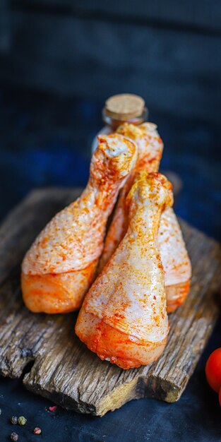 raw cChicken legs marinade paprika barbecue grilled meat poultry