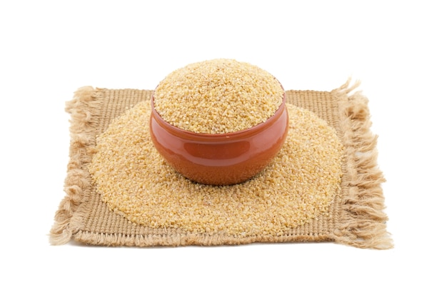 Raw Cereal Food Bulgur or Daliya on White Background