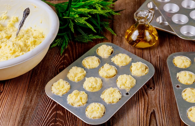 Raw cheese bread called chipa in baking tray.