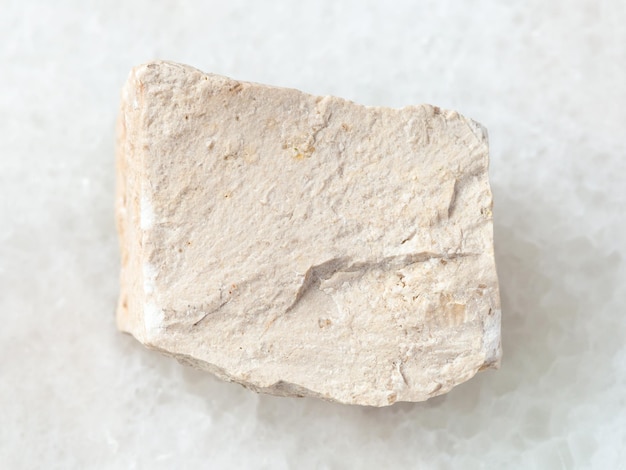 Raw chemical limestone stone on white