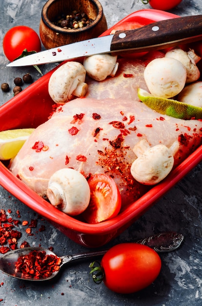 Raw chicken in baking dish