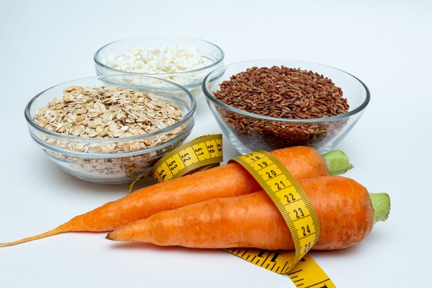 Raw chicken breast, cereals, brown rice, measuring tape, farm cottage cheese carrot 