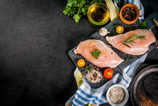 Raw chicken breast filet meat with spices and olive oil 