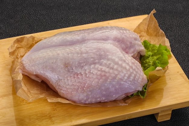 Raw chicken breast with skin