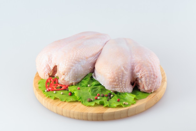 Raw chicken Breasts on white