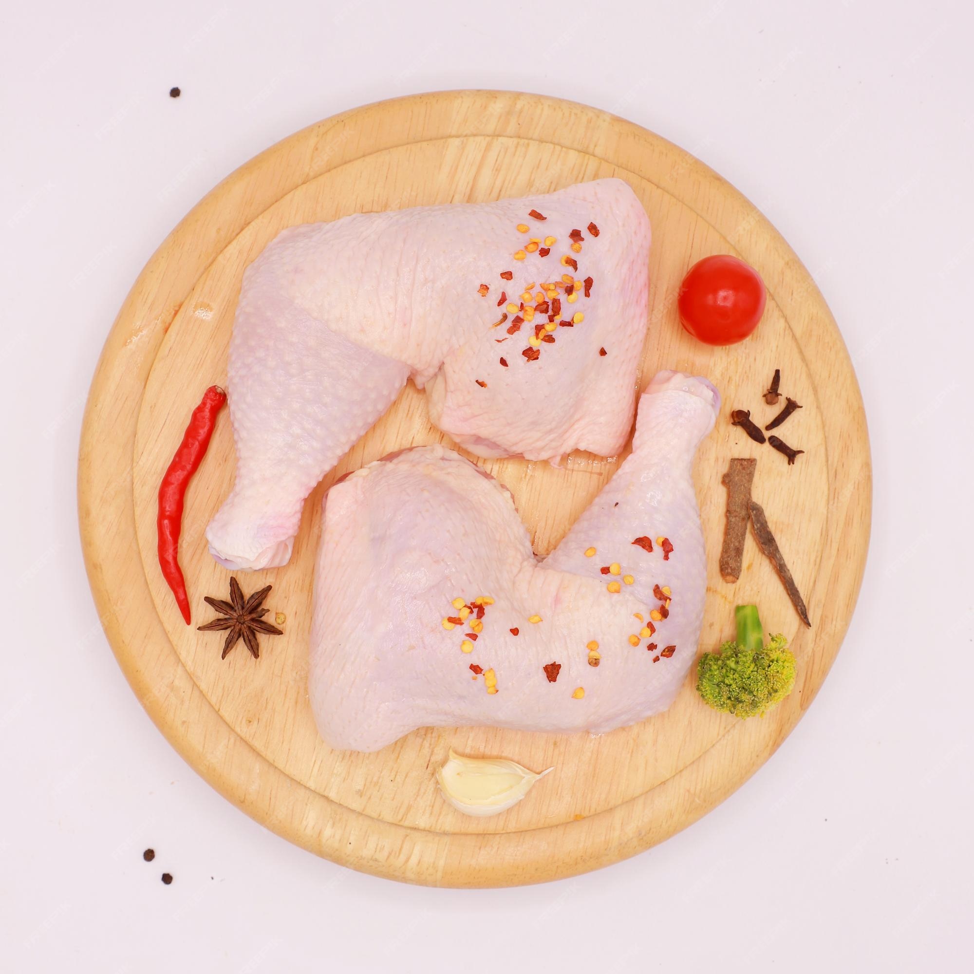 https://img.freepik.com/premium-photo/raw-chicken-cutter-board-with-vegetables-spices_991666-18.jpg?w=2000