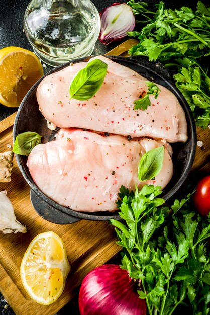 Raw chicken fillet with spices and herbs 