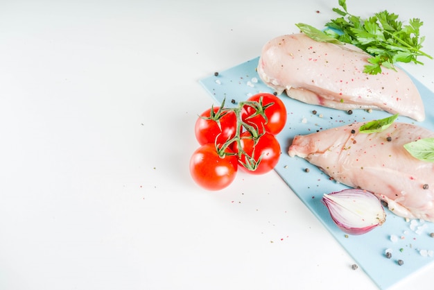 Raw chicken fillet with spices and herbs 