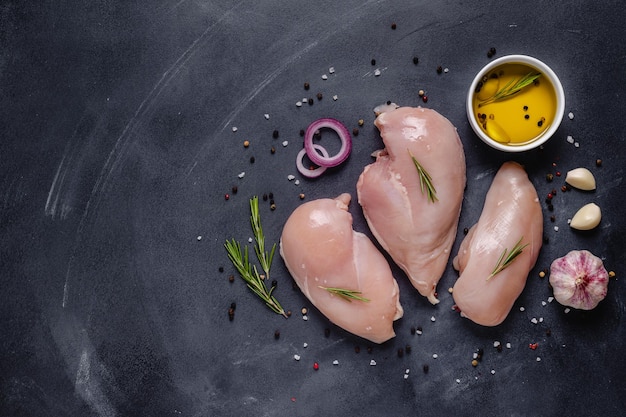 Raw chicken fillet with spices and herbs