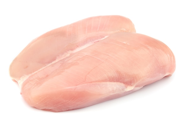 Raw chicken fillets close up on white