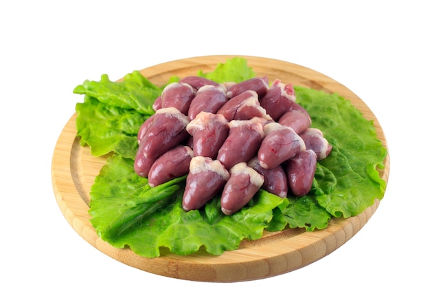 Raw chicken hearts on white background