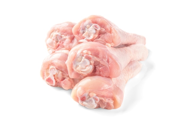 Raw chicken legs isolated on white.