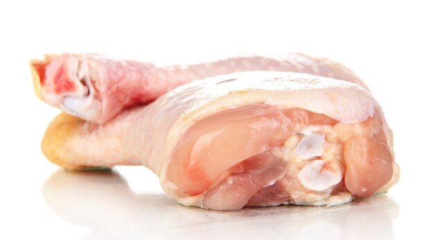 Raw chicken legs isolated on white