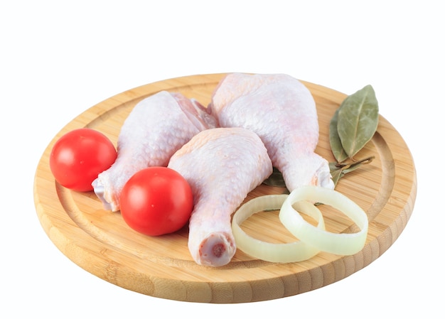 Raw chicken legs on a white background