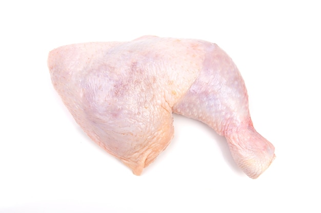 Raw chicken legs on white