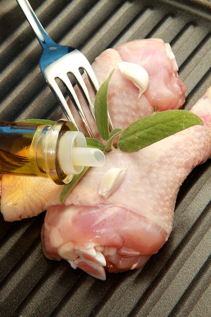 raw chicken legs with flavorings