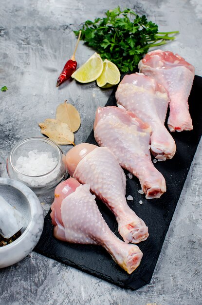 Raw chicken legs with spice