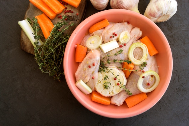 Raw chicken in the marinade with spices