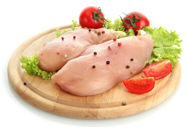 Raw chicken meat on cutting board isolated on white