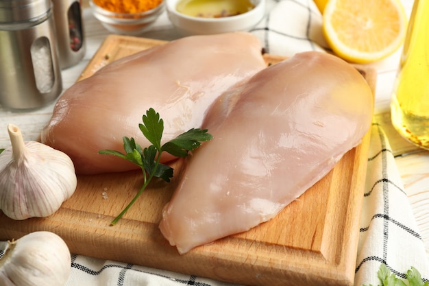 raw chicken meat and ingredients on wood. cooking chicken