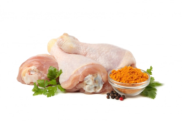 Raw chicken meat and spices isolated on white