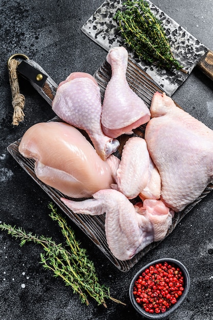 Raw chicken portions for cooking and barbecuing with skinless meat, drumstick and wings