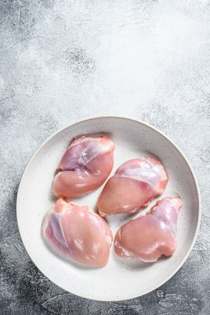 Photo raw chicken thigh fillet. top view.