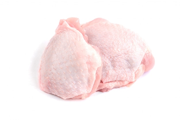 Raw chicken thigh isolated on white background.