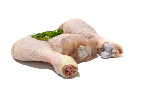 Raw chicken thighs isolated on a white background