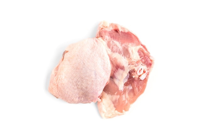 Raw chicken thighs isolated on white surface.