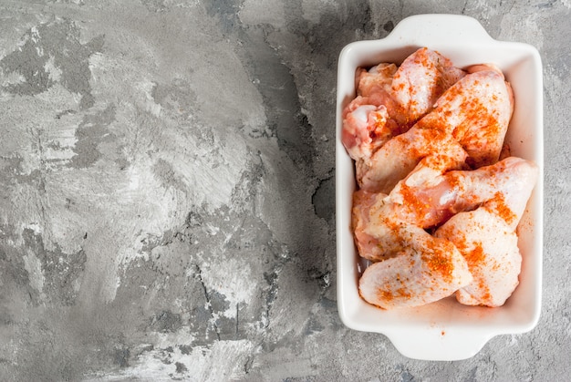 Raw chicken wings in a baking dish