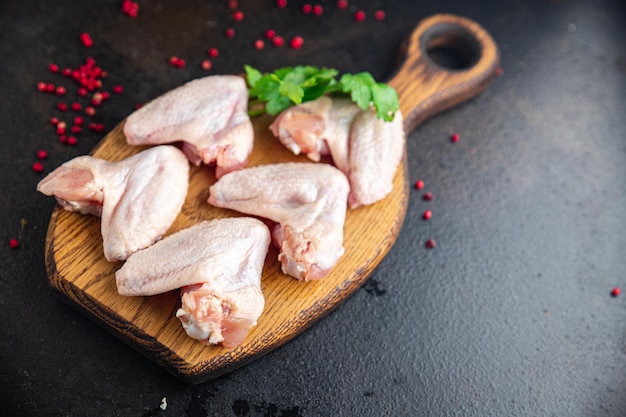 Raw chicken wings meat poultry fresh meal snack copy space food background keto or paleo diet