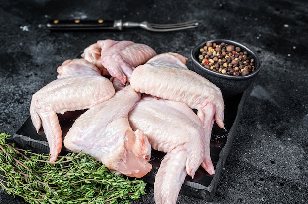 Raw chicken wings Poultry meat on a marble board