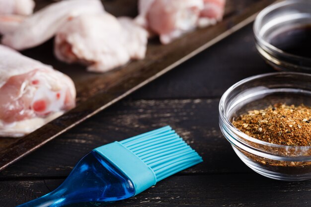 Raw chicken with spices ready to cook