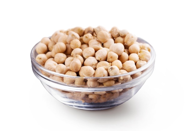 Raw chickpea in glass bowl, isolated on white background