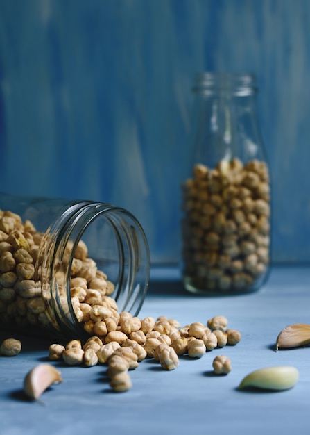 Raw chickpeas in a glass jar.