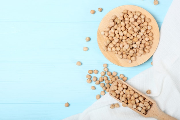 Raw chickpeas on the table on a light background closeup