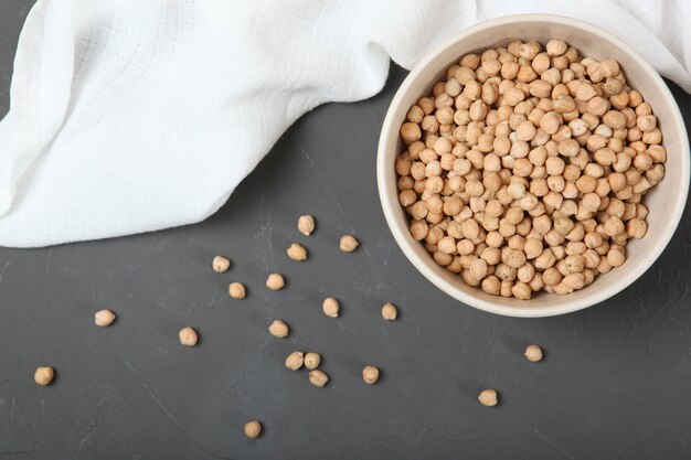 Raw chickpeas on the table on a light background closeup