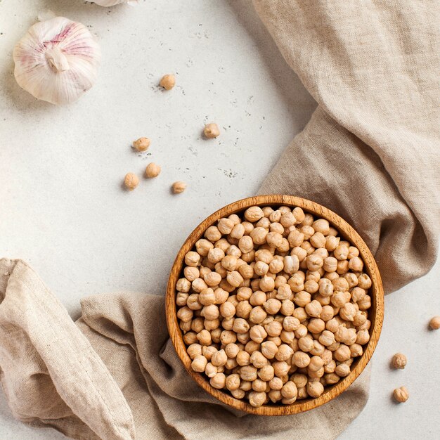 Raw chickpeas in a wooden bowl superfood copy space