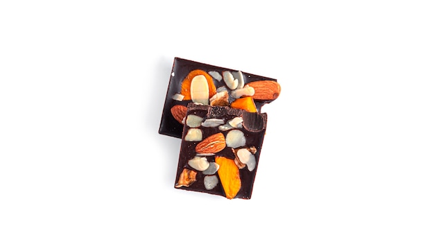 Raw chocolate bar with dried fruits and nuts on white