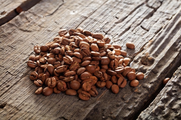 Raw coffee beans on table